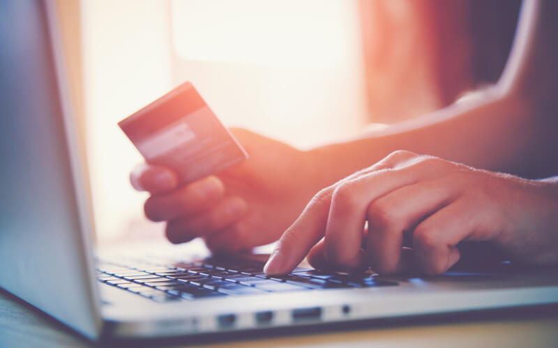 Women entering personal credit card information